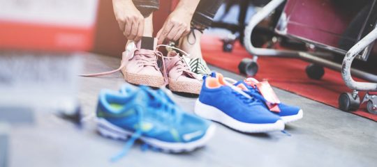 Woman looking shoes in store